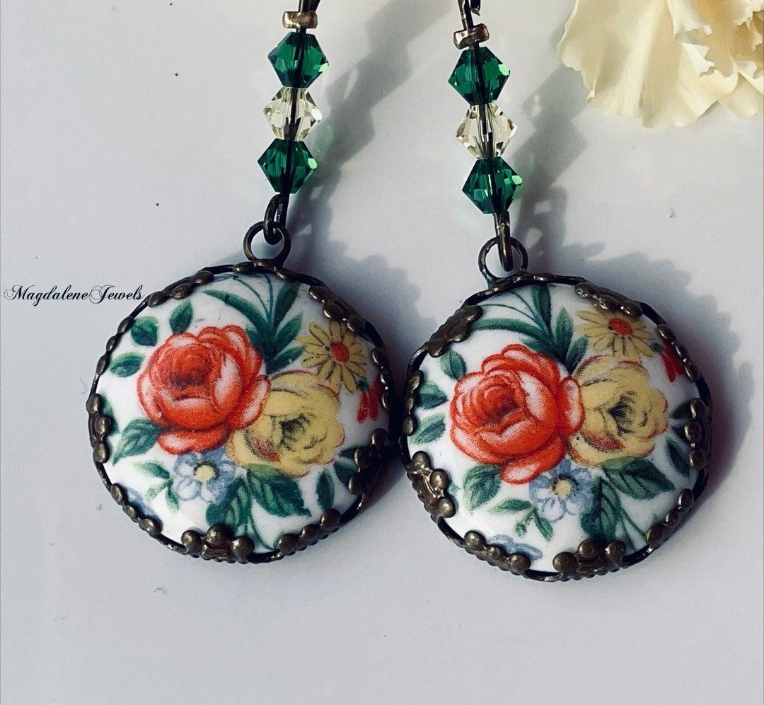 Adorn yourself with timeless elegance wearing these Vintage Porcelain Rose Earrings embellished with Swarovski Crystals. A perfect blend of vintage charm and modern sparkle. #VintageEarrings #SwarovskiCrystals #bmecountdown buff.ly/3SXKV2v