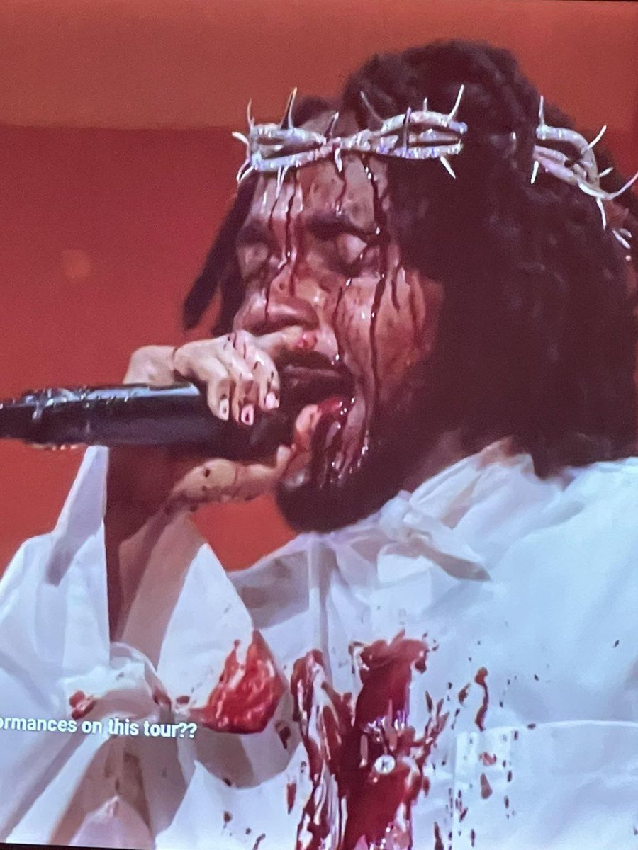 This is rapper Kendrick Lamar posing as Our Lord Jesus Christ in a crown of thorns. 

Jay Z calls himself Jehovah. 
Kanye calls himself Yeezus. 
Tupac was depicted as crucified like Christ. 

The industry is Christ-hating and Illuminati. Reject thug rap culture. It’s poison.