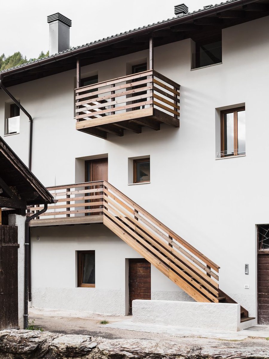 Preserving its 19th-century wooden roof while introducing skylights to flood the interiors with natural light, this renovation transforms a fragmented old structure into a cohesive modern home. Details: arc.ht/49Pk0w2 | 📍 Caldonazzo, Italy