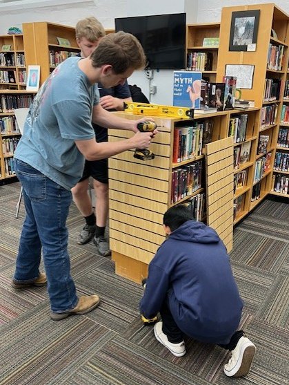 OverIntheLib's tweet image. Mr. Lewis's awesome students are in installing slatwall for me to display more books! They were pure professionalism.  #gettingfancyupinhere