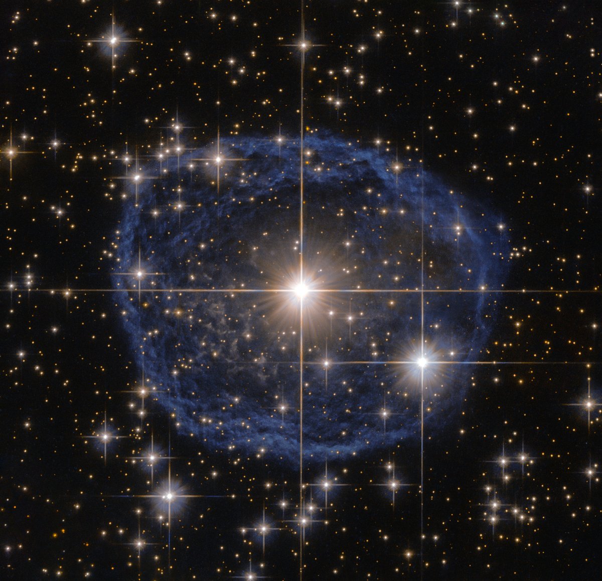 Hubble's bubble! 🫧 This blue 'bubble' surrounding a massive, late-stage star is called a Wolf-Rayet nebula. It was created when speedy stellar winds interacted with the outer layers of hydrogen ejected from the star! For more on this #HubbleClassic: go.nasa.gov/44abHKc