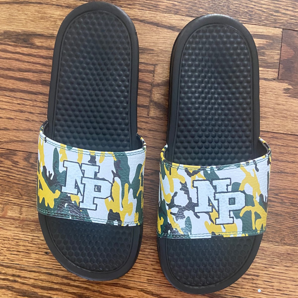 New Providence High School has 3 new slide colorways in the rotation: Forest green, white, and team camo!

#customslides #customclogs #promotionalproducts #promo #swag #spiritwear #teamapparel #teamgear #fundraisingideas #fundraiser #customsandals #customslidesandals #teamslides