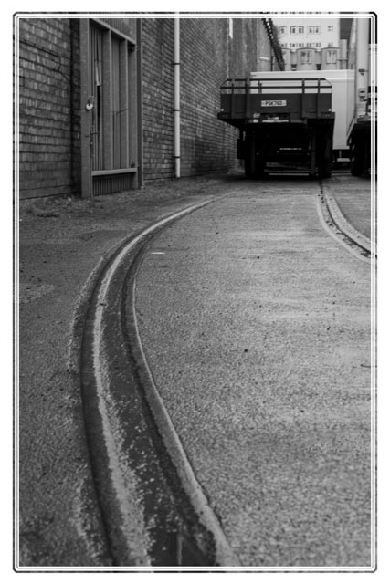 An #old #warehouse in #salford #quays from before the times of the #Regeneration. It is clearly still being used by a #localbusiness but the tracks are no longer needed. Shot in #blackandwhite by a local #photographer @photos_dsmith. #blackandwhitephotography #photography #image