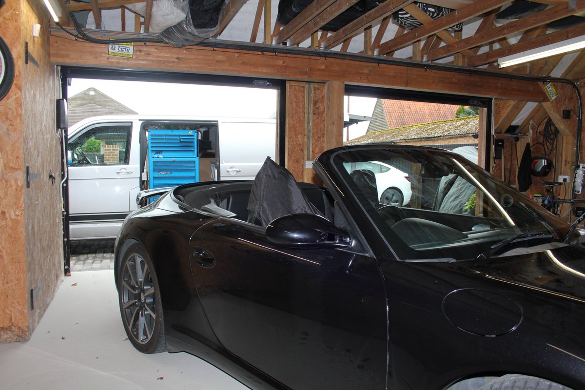 A 997 cabriolet, in its home, having a new windscreen fitted.