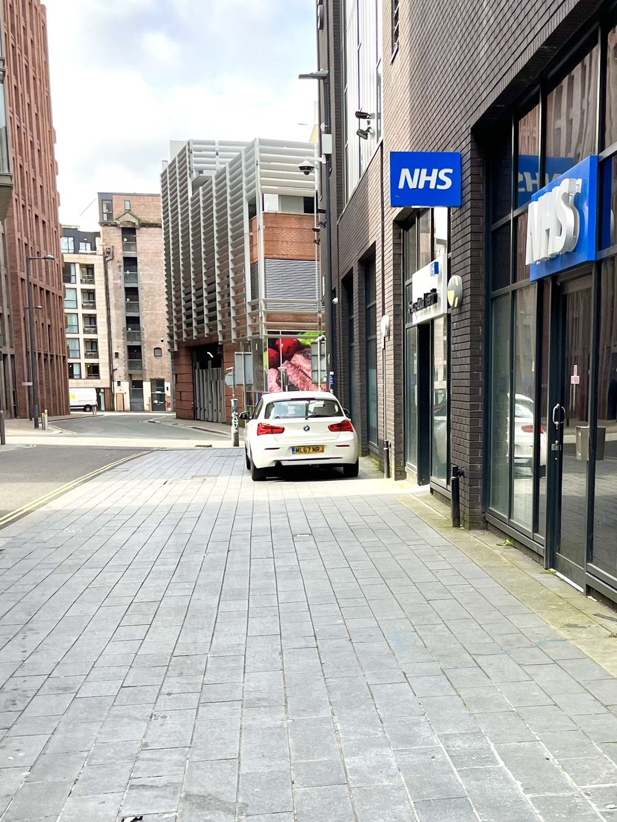 Pavement driving outside NHS David Lewis St 22Apr24