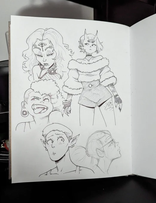 Cleaned up and inked some lady doodles in my sketchbook. 