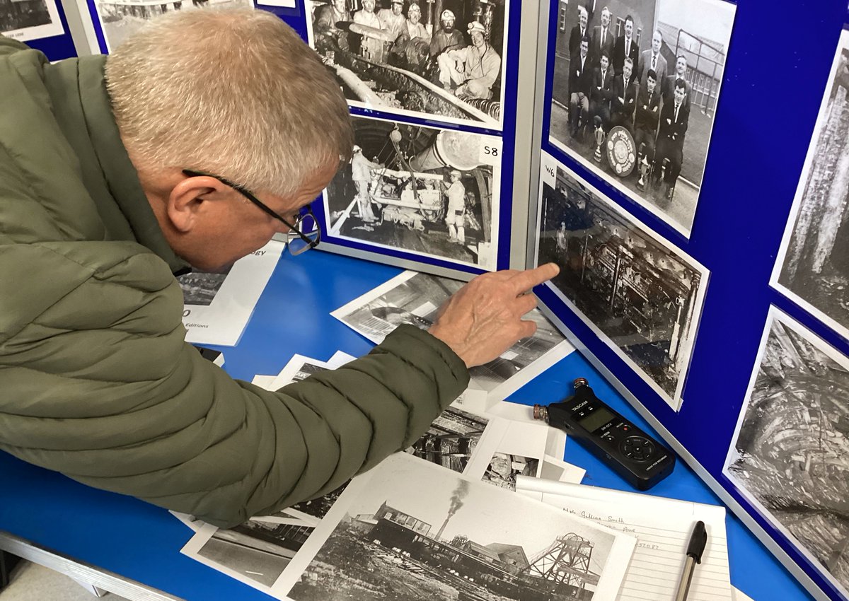 Ex Whitwick & Asfordby miner & pitman-poet, Roger Cornish, identifying former Whitwick Colliery workmates on a 1979 @CoalAuthority photo as part of the @ntuhum 'Mine-craft the Prequel' display at the 'People, Places & Events' heritage day at Snibston Colliery on 21st April 2024.