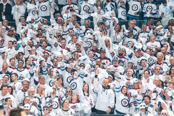 Photo of the Winnipeg Jets crowd dressed in white. 
