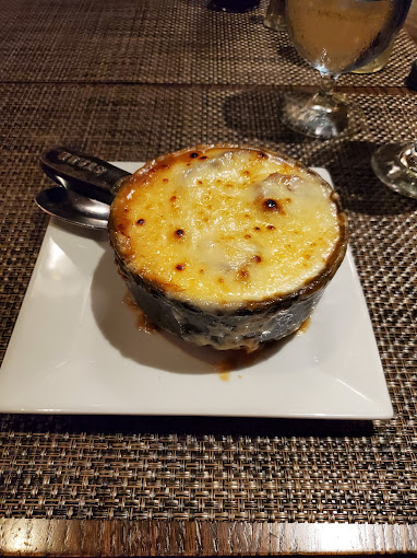 Just look at the melted gruyere cheese topping our roasted onion soup. If you need a dish that will warm your insides, this is it! #onionsoup #gruyere #flavors #deliciousflavors #warmandgooey #gooeygoodness #souplovers #oldhomestead #nyceats #nycfood #nycfoodie #foodfinds