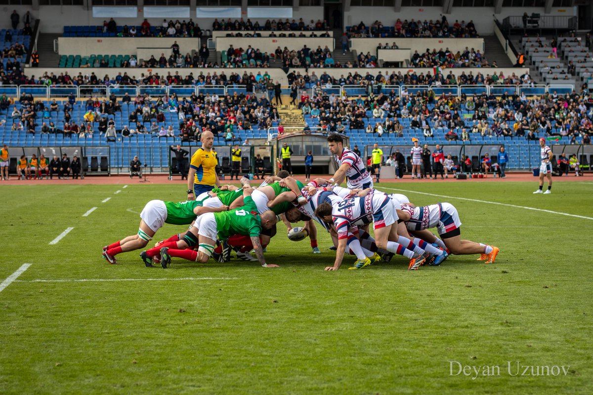 Bulgaria vs. Serbia Rugby Clash A moment capturing the fierce competition between Bulgaria and Serbia at Vasil Levski Stadium! As the two teams battle for possession over the ball, the stadium roars with anticipation. The match ended with a triumphant 30:7 score for Bulgaria