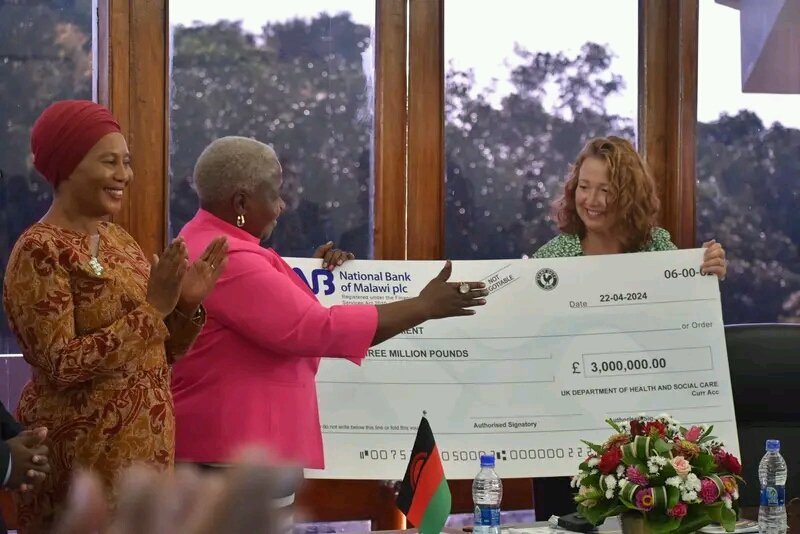 UNCMalawi's tweet photo. The Fleming Fund Phase II (2024-2028) was launched today at the Ministry of Health Headquarters in Lilongwe.  Ms Fiona Ritchie, the British High Commissioner to Malawi, symbolically presented a 3 million Pound Sterling (about MK6.4 billion) cheque to the Minister of Health. https://t.co/1Aeob1Tfjn