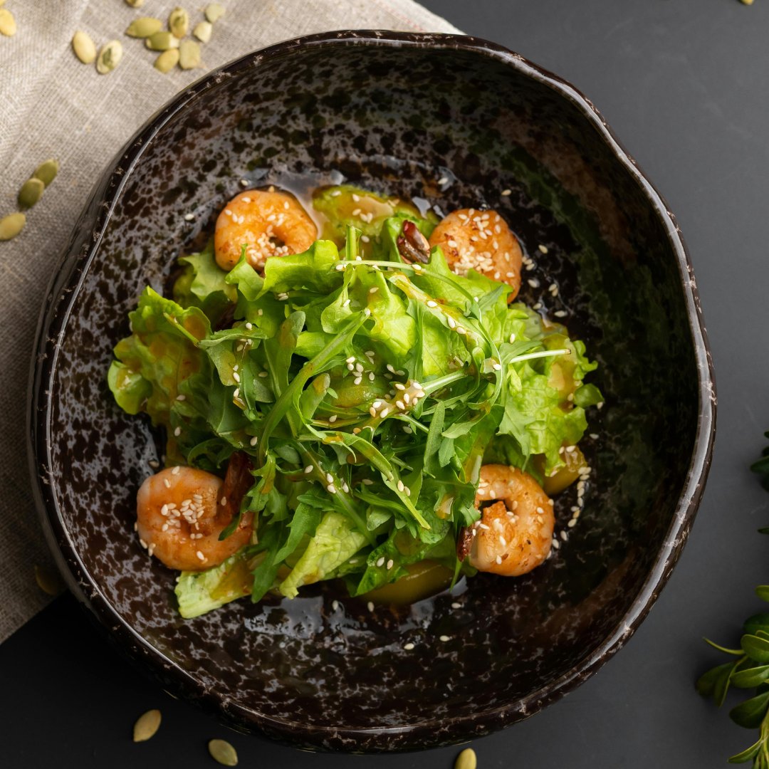 Enjoy this Asian Sesame Shrimp Salad recipe!

Mixed Greens
1lbs Tiger Shrimp
1 tbsp Honey
1 tbsp Lime Juice
2 tbsp Sesame Seeds, toasted
2 cloves garlic
S&amp;P
