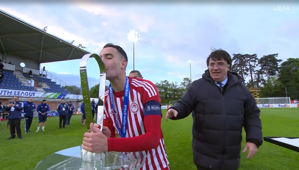 foet247europa's tweet photo. Athanasios Koutsogoulas makes history by becoming the first Greek club captain to lift a UEFA trophy. #UYL #OLYMIL https://t.co/MFiC7sn3nv