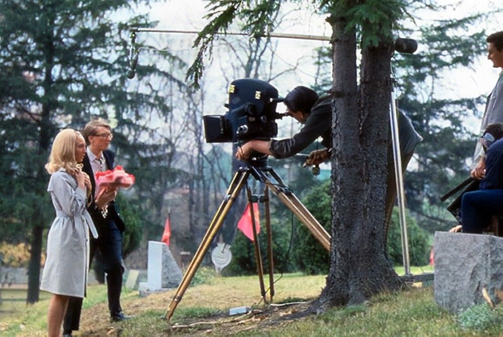 A rare colour photograph of twenty-seven year-old George A. Romero (with actors Judith O'Dea and Russell Streiner) filming the opening sequence of NIGHT OF THE LIVING DEAD (1968). As most fans know, the location chosen for this was the Evans City Cemetery in Pennsylvania. #horror