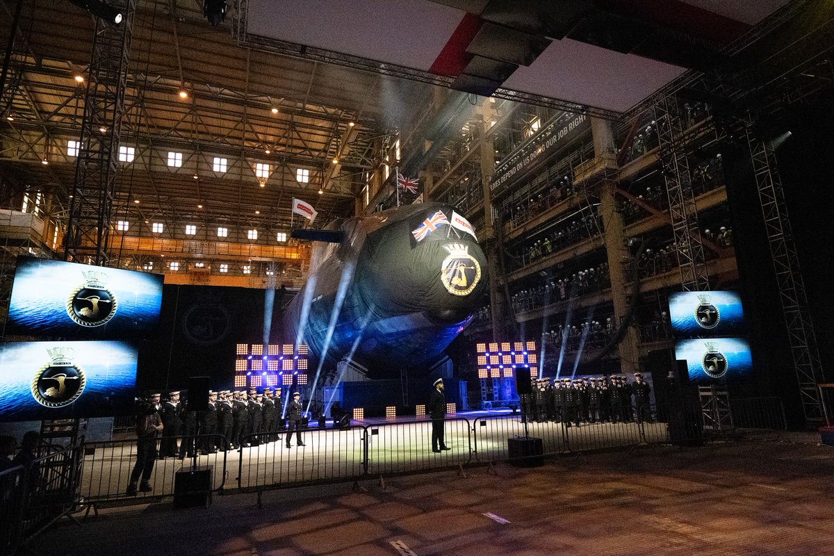 HMS Agamemnon naming ceremony. Behind that black screen, the future Dreadnought is taking shape. To the left, outside of the picture, is the last Astute class boat, Agincourt.