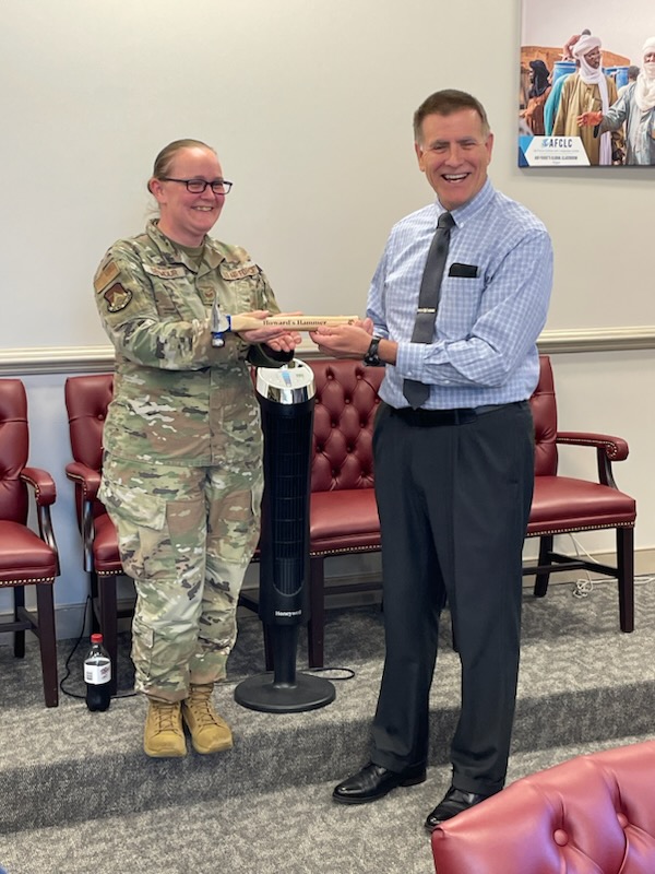 AFCLC Director Howard Ward presents Staff Sgt. Kelli Seymour with 'Howard's Hammer' for crushing a high-priority task. #WeAreAFCLC #AFCLCGlobalClassroom