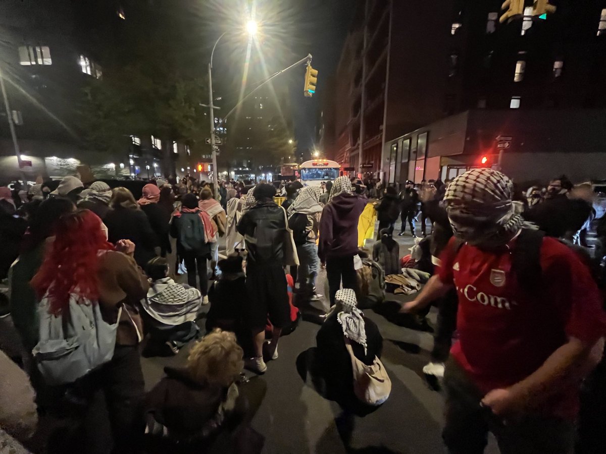 NYPD jail buses are being BLOCKED from leaving. The NYU Gaza encampment is being dismantled but the students and protestors are undeterred!