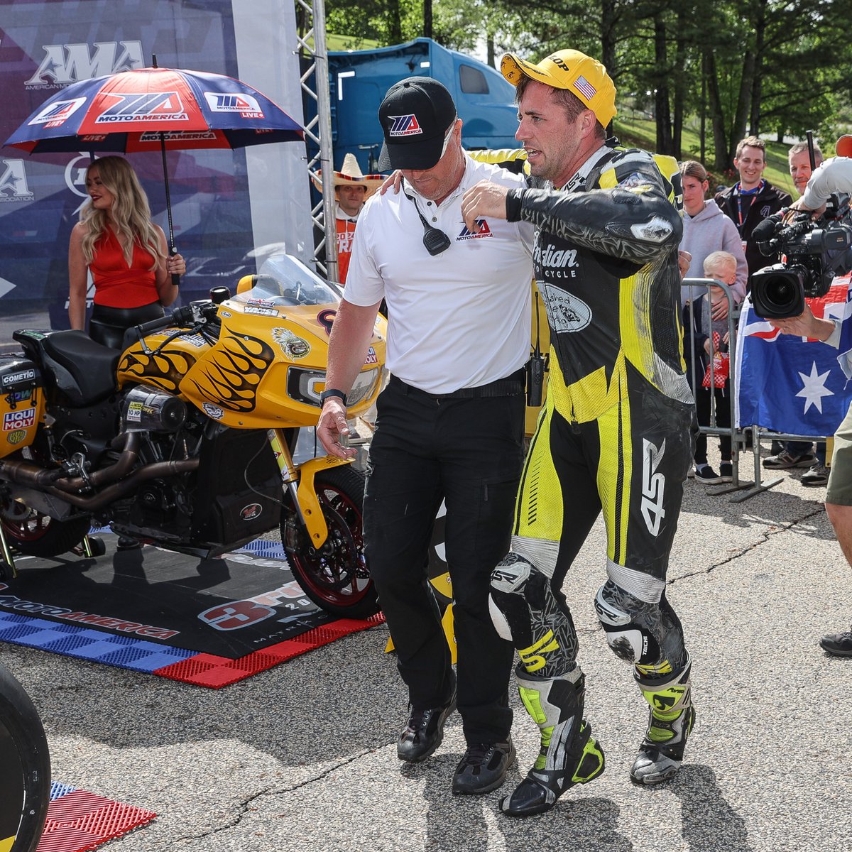 MotoAmerica's tweet photo. .@Max888racing crashed in the Superbike race 2 that took place just before the Mission King Of The Baggers race 2. He manged to place 3rd with an injury. He may not have needed help completing the race, but he may have needed help getting onto the podium. Thanks @TroyHerfoss! https://t.co/RryJJHpCKG