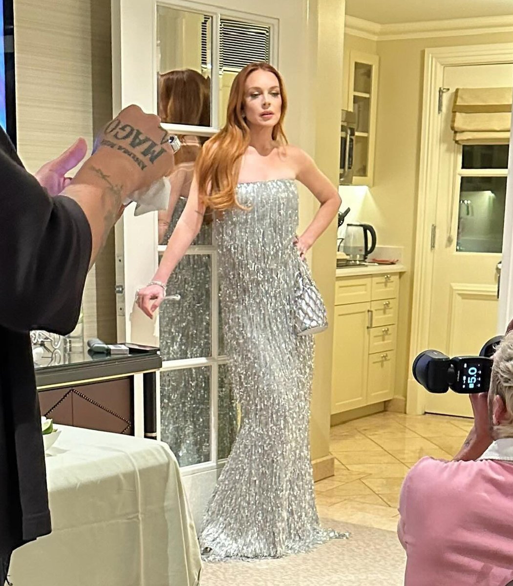 Lindsay Lohan getting ready for the Vanity Fair Oscar Party last month