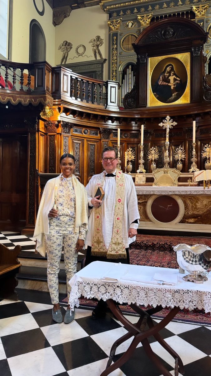 Candace Owens on the black and white masonic checkerboard floor.