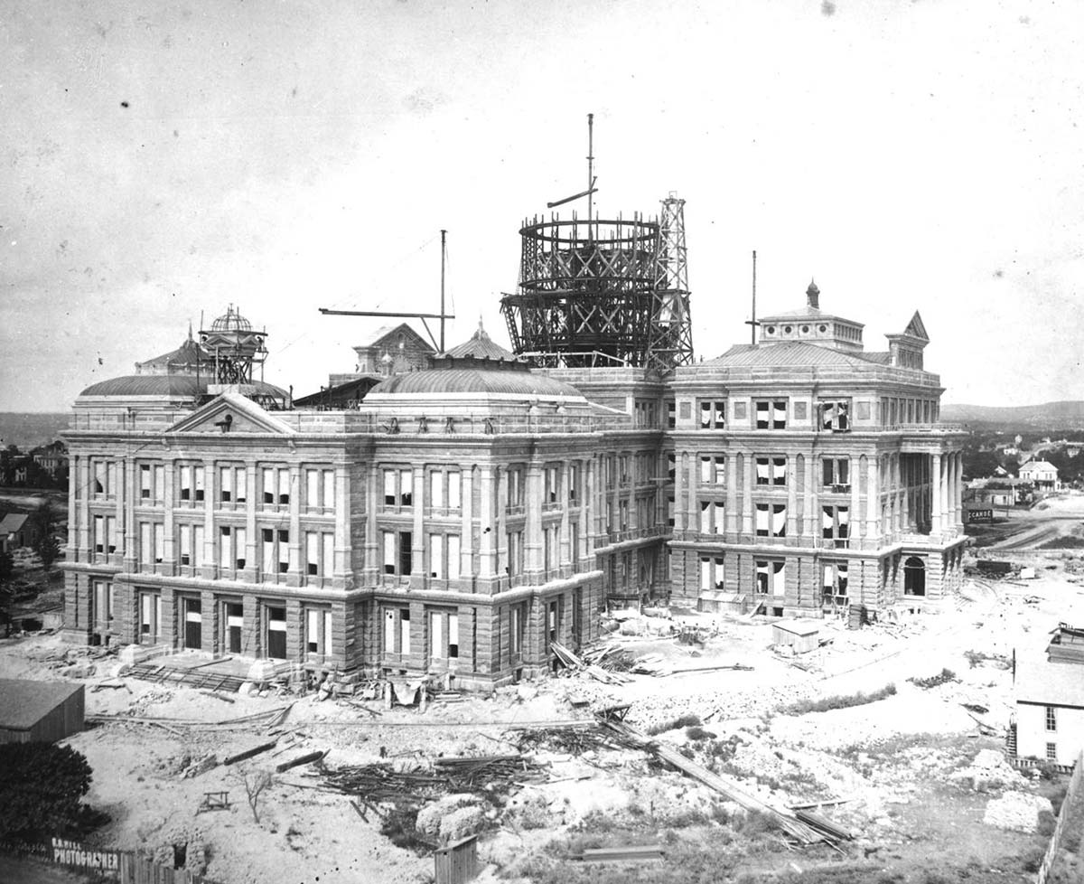 The Texas State Capitol building under construction in Austin, 1887. Occupying 22 acres on a hilltop in the center of downtown Austin, upon its completion the Capitol was touted as the seventh largest building in the world; today it remains the largest (though not the tallest)