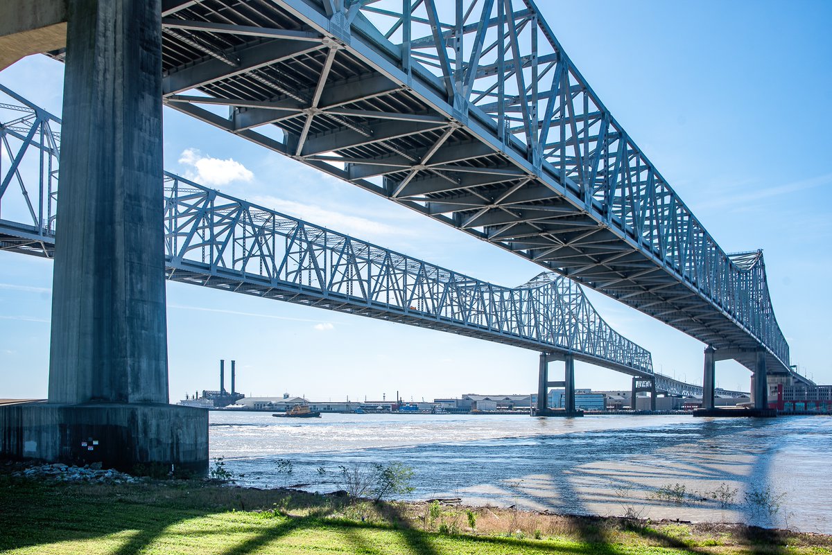 The Crescent City Connection Bridge in New Orleans, Louisiana, soaring over the Mighty Mississippi on a warm spring day in 2023.