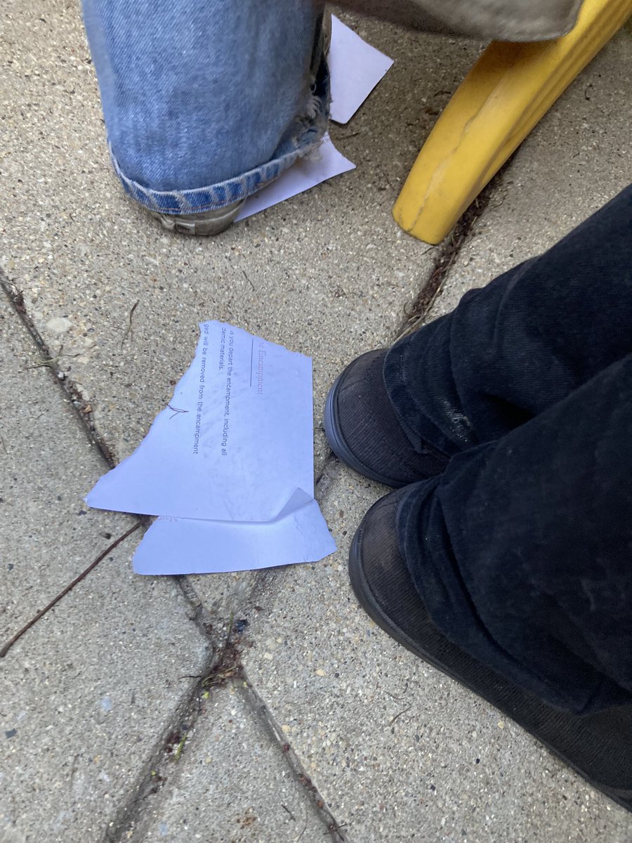 Remnants of university final notice torn up at protesters’ feet