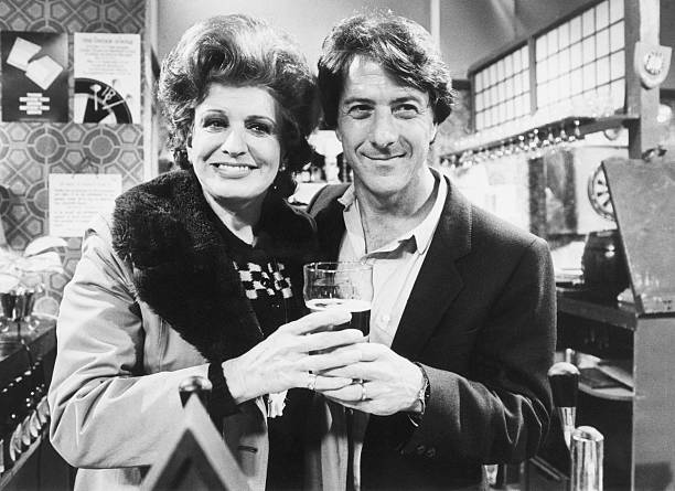 April 1983. Dustin Hoffman, in England for the opening of the film 'Tootsie', visits Pat Phoenix on the set of 'Coronation Street'.