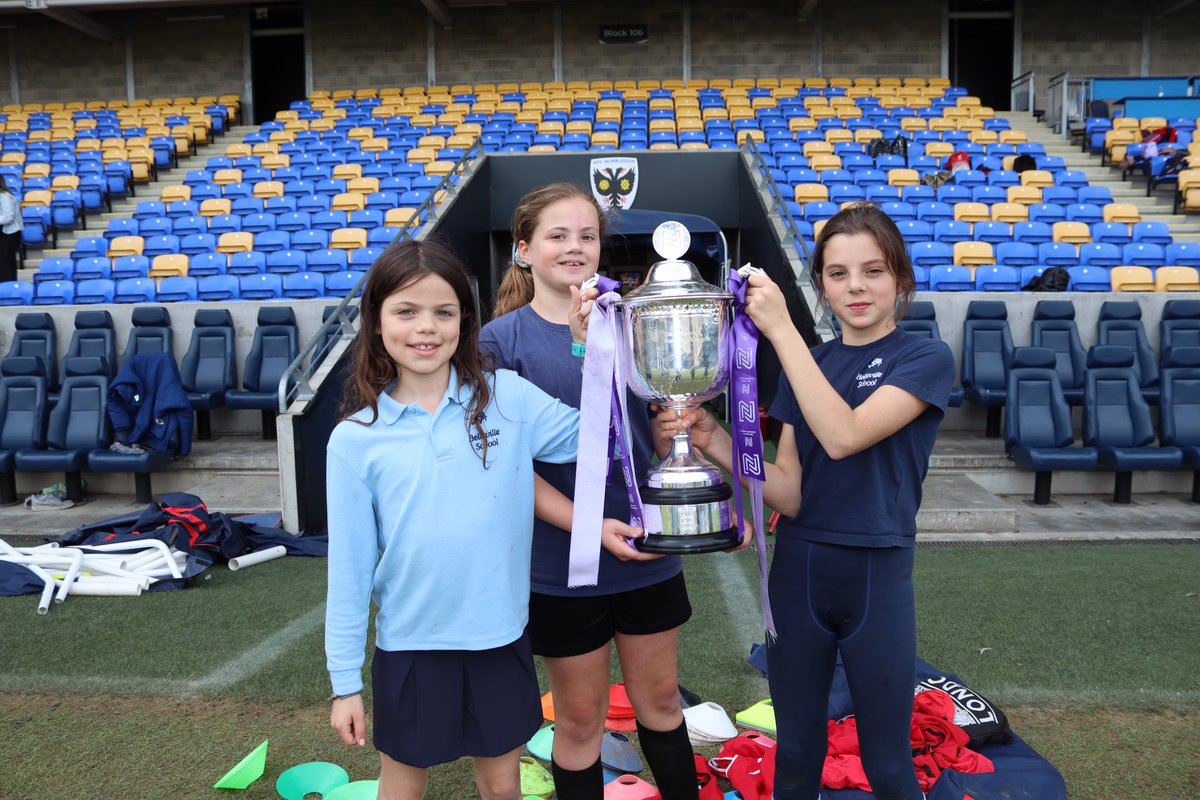 Hands on the cup! 🏆 @afcw_women’s first-team coach Andy May pictured with students from St Michael’s and Belleville Schools at today’s @AFCW_Foundation Football Festival 📸 Thank you to the 20 local schools who took part in the event 🙌 #AFCW 🟡🔵