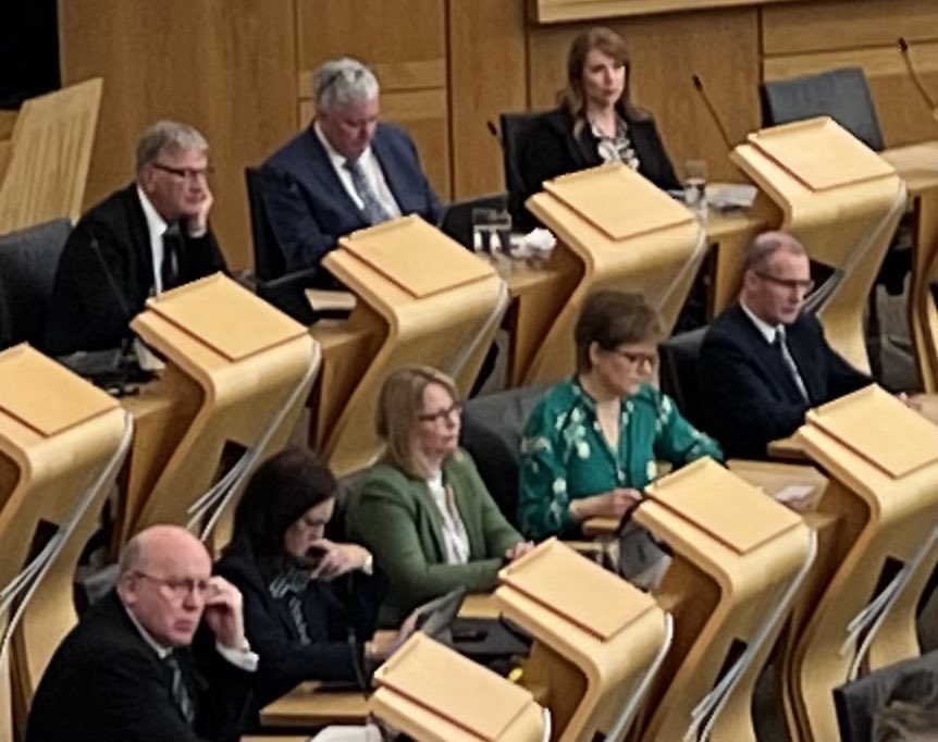 One former FM in the chamber to hear the resignation speech of her successor who will become the second former FM to sit on the backbenches this parliamentary term, and to vote for his successor, who will be the third FM this term, but who used to her former deputy FM.
