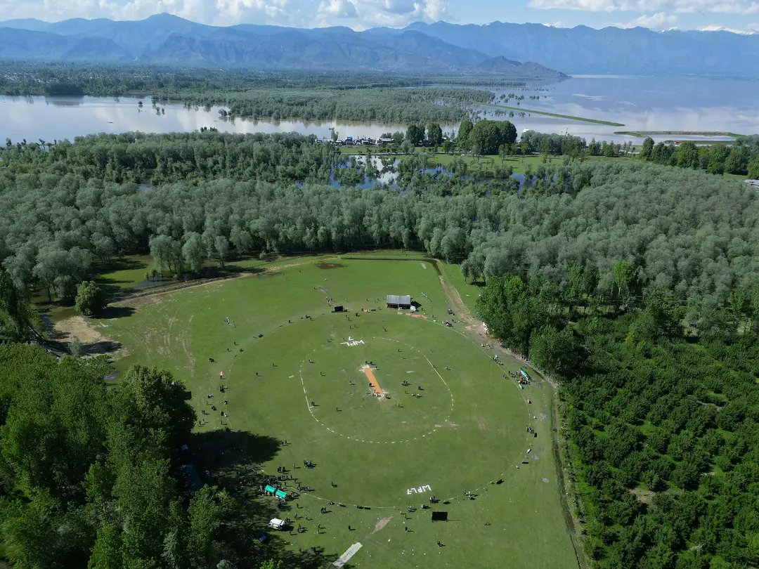 Not England,Not New Zealand . 
This cricket stadium is in Kashmir Sopore . Currently WPL is going on this beautiful stadium.
Sheikhul Alam Cricket Ground Tarzoo Sopore . @BCCI We have many such sports field in the valley but it needs the attention of administration.