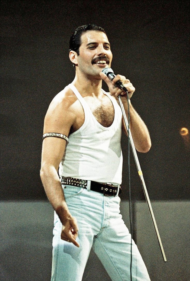During a gig in the early ‘70s, Queen frontman Freddie Mercury tried to remove his mic from its stand. Instead, the bottom half of the mic broke leaving it attached to half of the shaft. Mercury liked the mic and stick prop and used it for much of the rest of his career. 
#queen