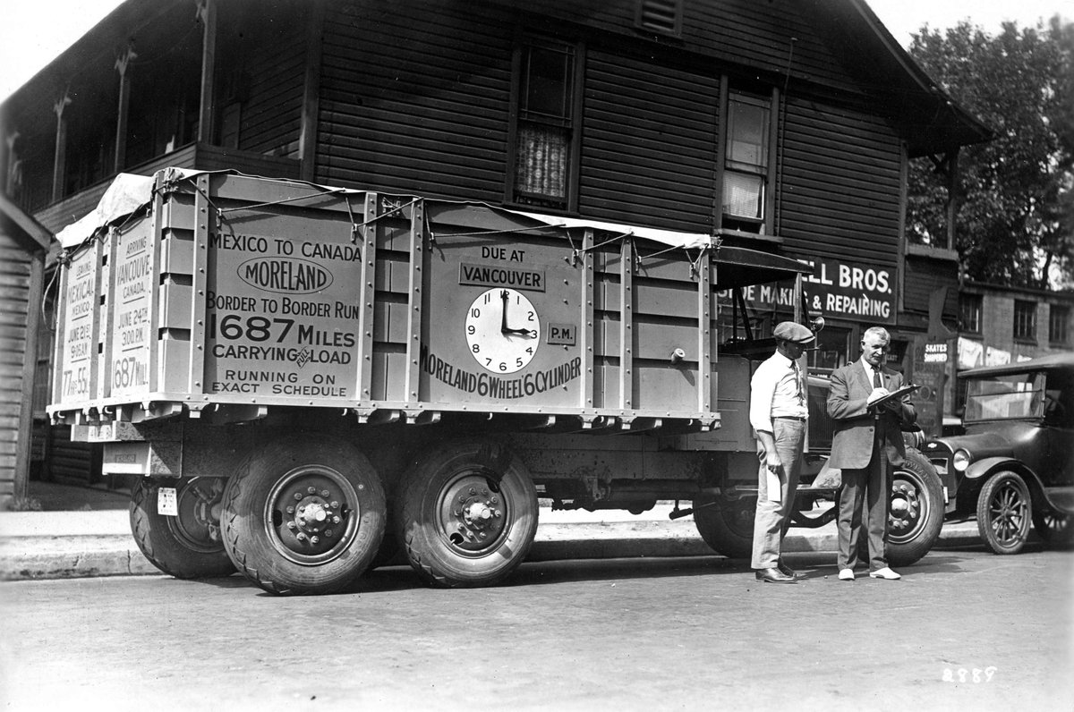 Image: [Driver making delivery with Moreland six wheel six cylinder transport truck] [1925?] note: Sign on side of truck reads: 'Mexico to Canada, Border to Border Run.' Ref Code: AM1477-1-S5-: CVA 1477-684 ow.ly/cSHJ50Rrk47 #CincoDeMayo #VintageTruck