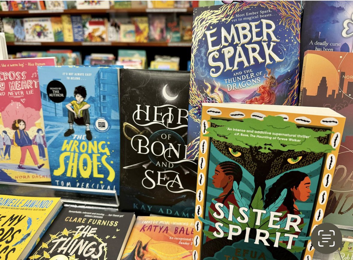 Been hearing so many brilliant things about @newsfromnowhere bookshop in Liverpool - and a friend just sent me a photo of EMBER SPARK on display there! 💚🐉💚