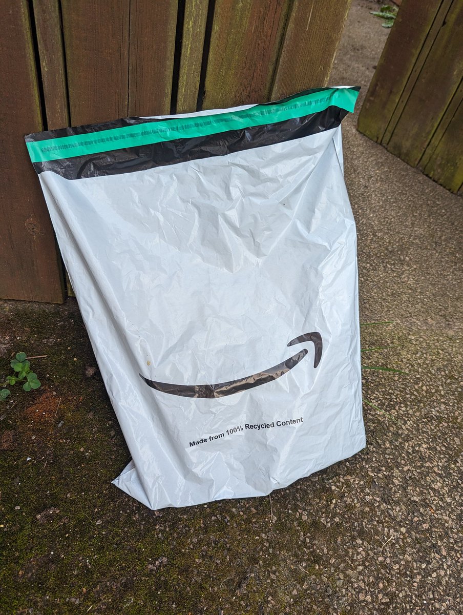 garyhogarth's tweet photo. I looked out my window last night + there was a black + white item in the road, fearing the worst (we have cats) I went outside and I found an #amazon packaging bag...relieved I pick it up...it's heavy and filled with liquid....by the smell...urine. https://t.co/egCQbKgAsE