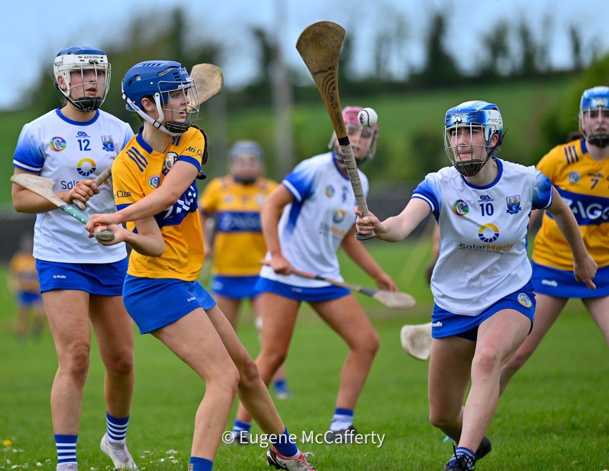 Clare’s Kate Kennedy clears the ball from the danger zone ahead of Waterford’s Kim McGrath in the first round of the U16 All Ireland Camogie Shield Championship. At halftime it’s @ClareCamogie 1-4 @deisecamogie 2-7. Photograph by @eugemccafferty.