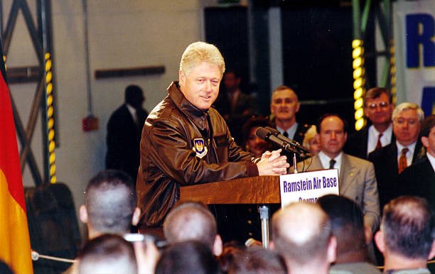 President Clinton and Senior Airman Eric Reininger walk to their table during a dinner at Ramstein Air Base, Germany. 

Clinton is visiting the base to personally thank U.S. troops for their support of NATO Operation Allied Force, the air operation against targets in Yugoslavia.