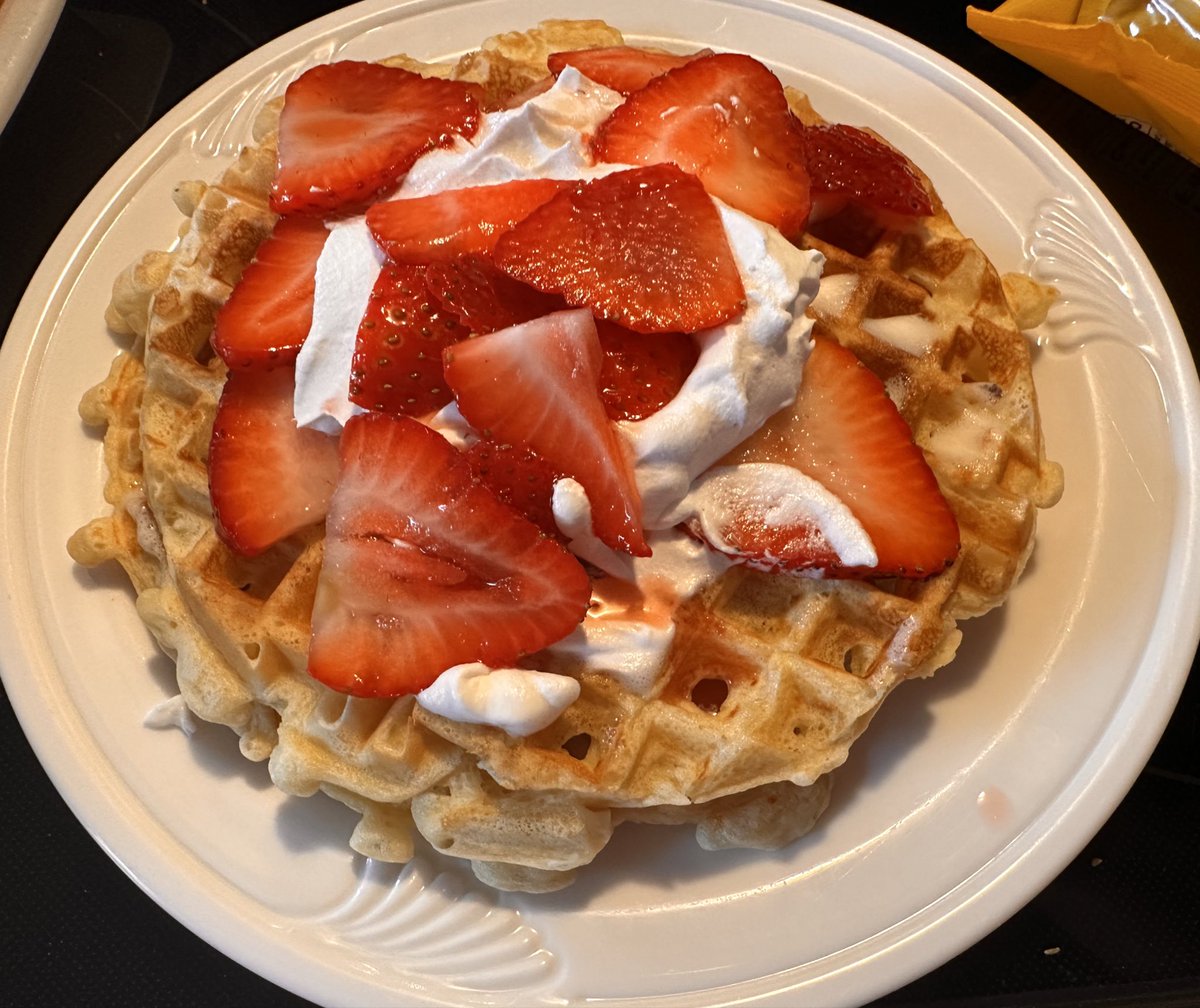 Waffles with strawberries and whipped cream for breakfast #twittersupperclub