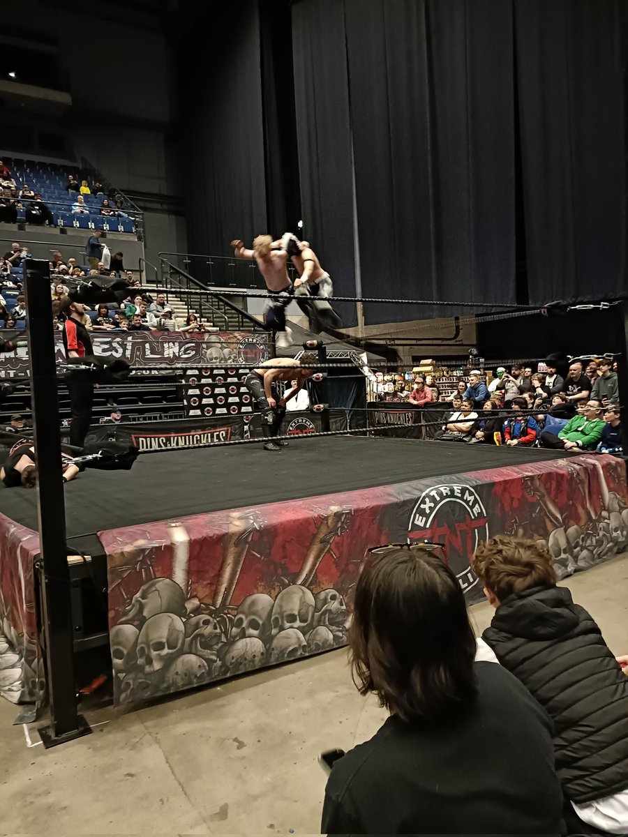 @KidLykos and @KidLykosII come off the top rope onto @Critchy01 at comic con