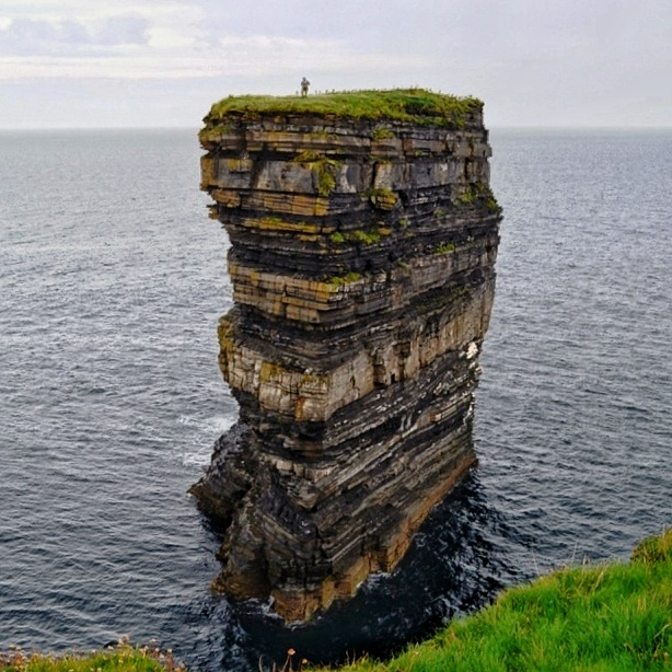Just a few miles north of Ballycastle,  overlooking the wild Atlantic, lies the rugged, windswept outcrop of Downpatrick Head.
Saint Patrick and the pagan chieftain , who refused to convert to Christianity  attempted  throw Patrick into his everlasting fire