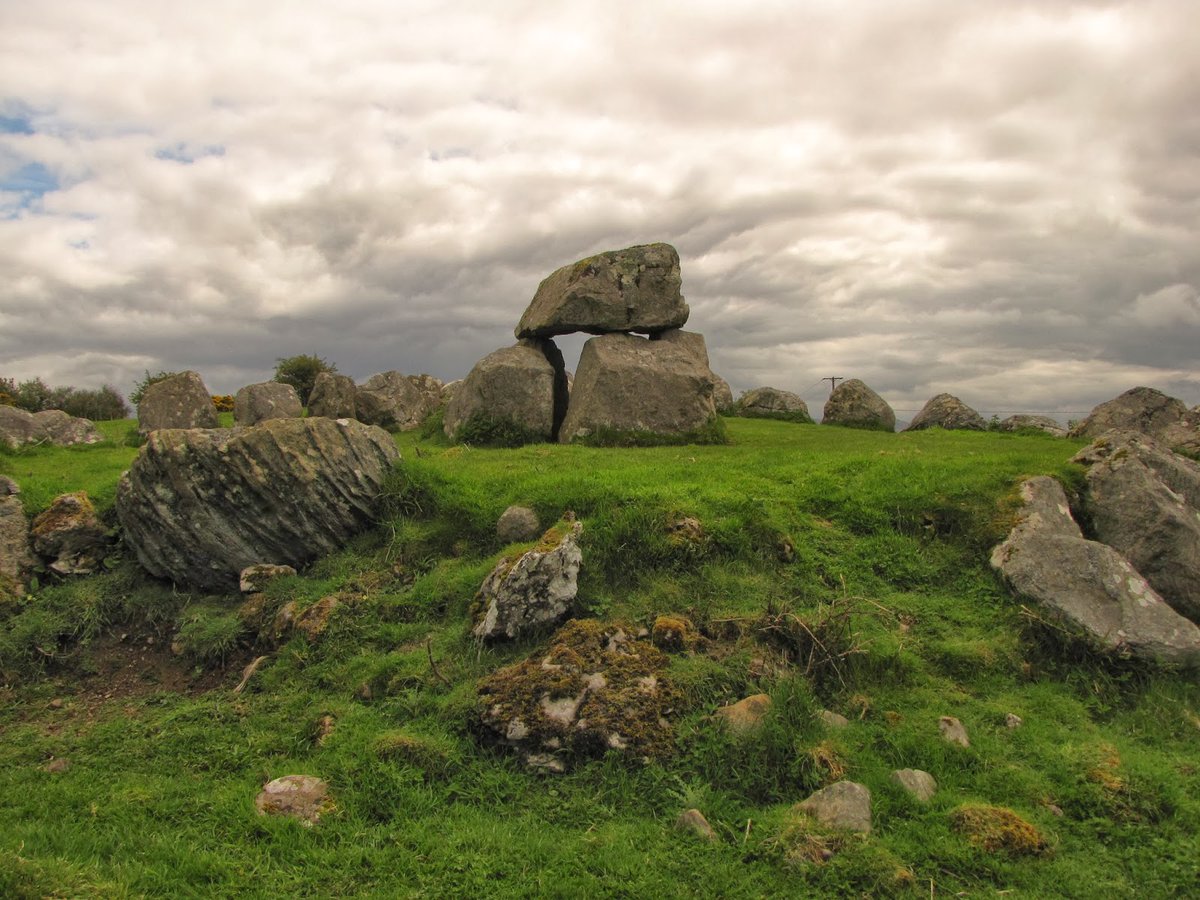 Carrowmore is a large group of megalithic monuments on the Coolera Peninsula to the west of Sligo, Ireland. Built in the 4th millennium BC. There are 30 surviving tombs, making Carrowmore one of the largest clusters of megalithic tombs in Ireland. Wikipedia, NMP.