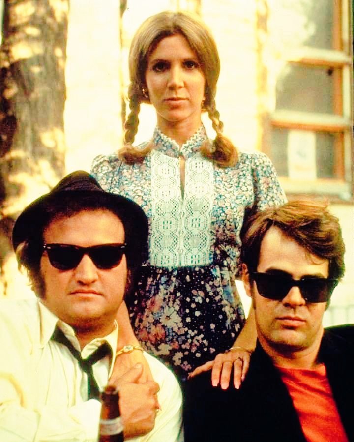 John Belushi, Carrie Fisher and Dan Aykroyd on the set of The Blues Brothers 1980. Photo by ©Everett Collection Inc.