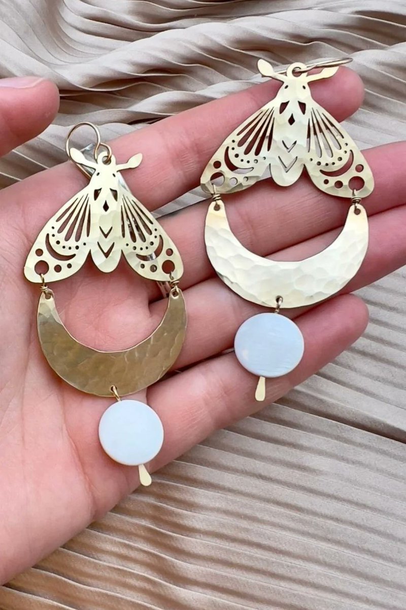The Fluff Hardware Luna Moth Earrings are just so pretty that they're a must-have accessory for any outfit. shopqueenofhearts.com/collections/je…