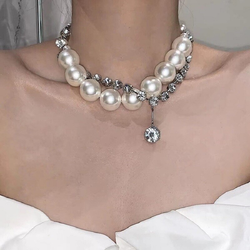 Turn heads with the timeless elegance of pearls, combined with the sparkling allure of rhinestones! Discover your next favorite piece at YongxiJewelry.com  #JewelryLovers #EleganceRedefined #YongxiJewelry #PearlNecklace #RhinestonesNecklace #BridalJewelry #EveningWear