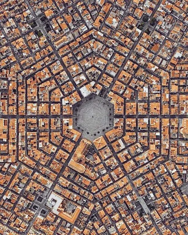 In the province of Catania, in the Italian island of Sicily, is the town of Grammichele. 

One of the few towns in the world to have this unique hexagonal layout.