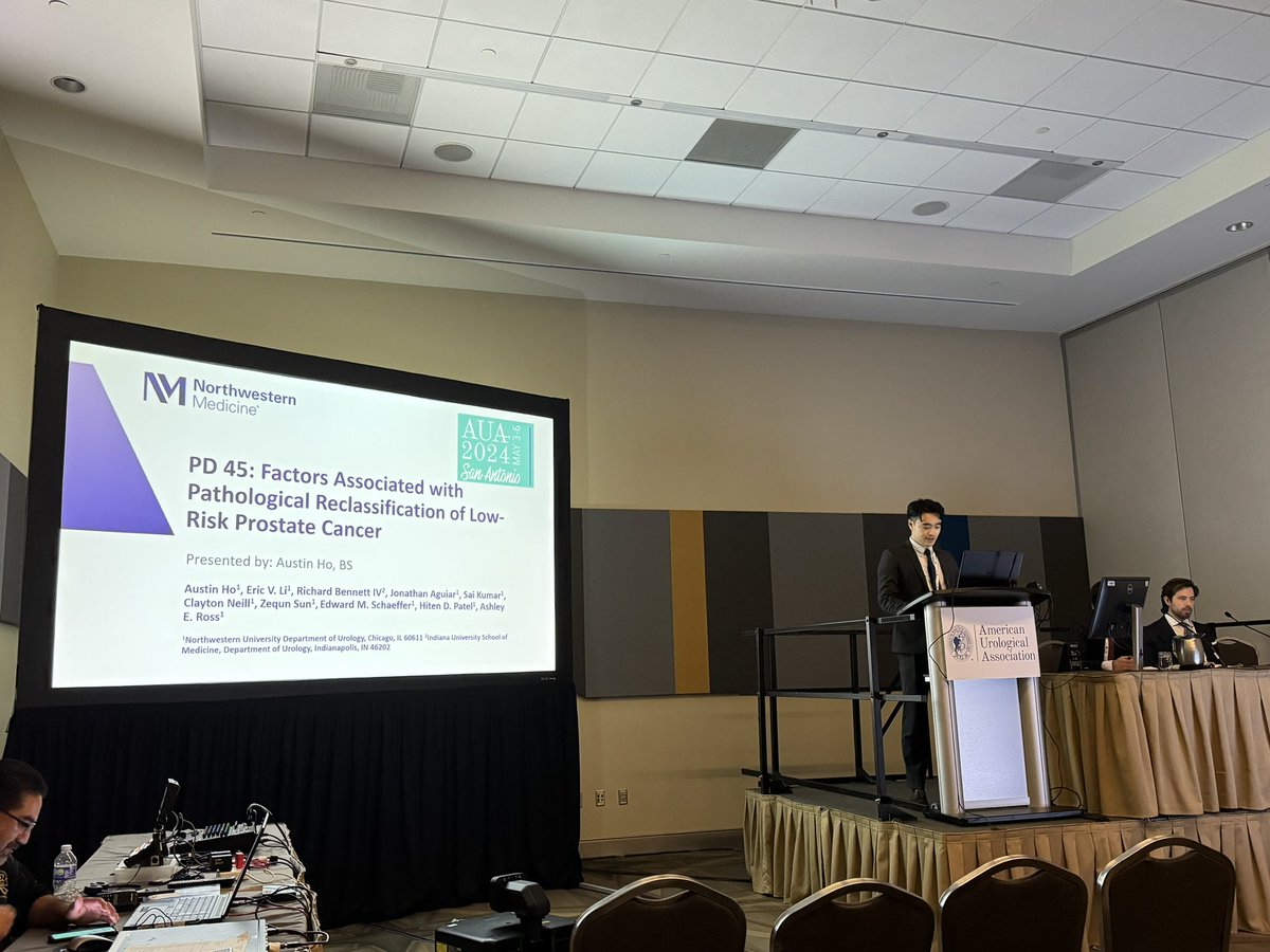 .@NUFeinbergMed student, Austin Ho, MS2, at the podium to discuss factors associated with pathological reclassification of low-risk #ProstateCancer. @AmerUrological #AUA24