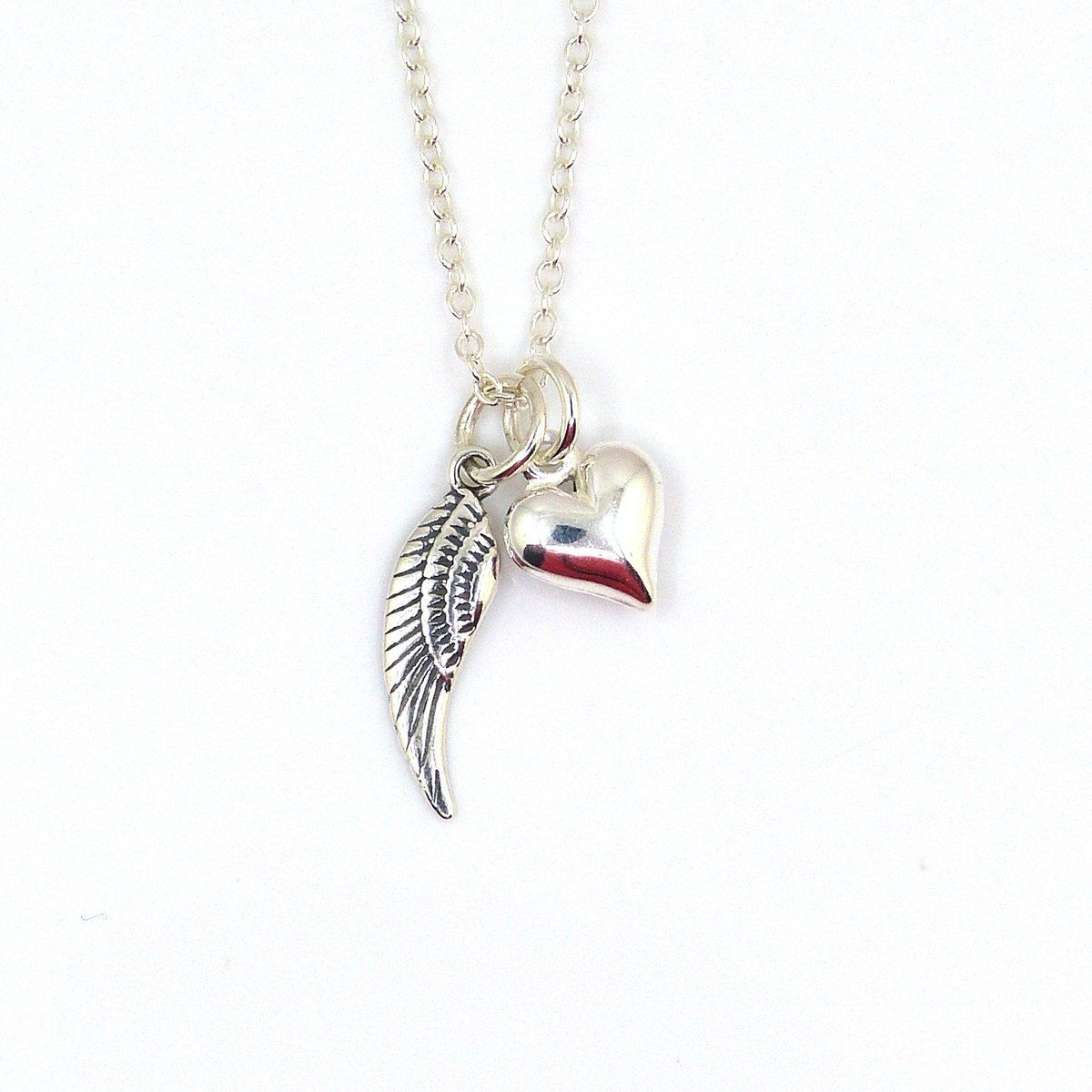 Sterling Silver Angel Wing and Heart Charm Necklace - Guardian Angel Necklace tuppu.net/bd33d033 #HandmadeHour #thestrandline #MHHSBD #shopindie #craftbizparty #UKGiftHour #UKGiftAM #EarlyBiz #elevenseshour #womaninbizhour