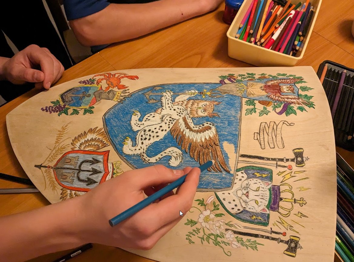 In which four students design coats of arms for themselves. The noblest elements of each design are combined in the center of the shield and apparently a new dynastic house has been founded.