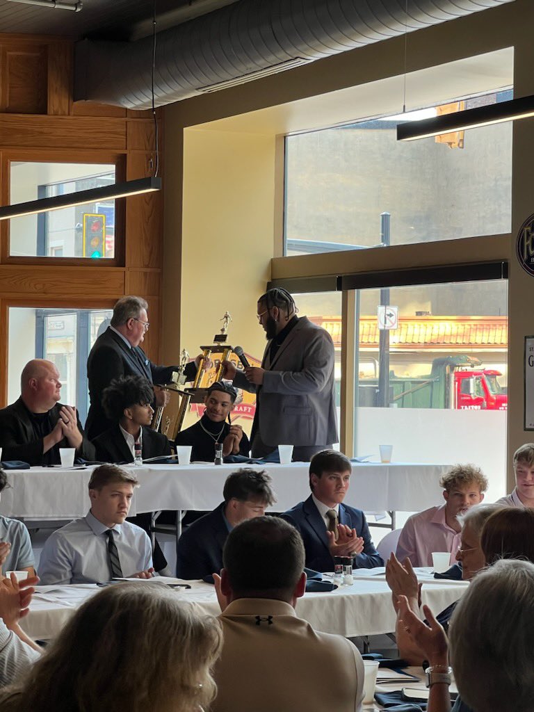 Rashad Reid being recognized at the 77th Victory Awards Dinner for his reception of the Joe Sydahar Award as top interior lineman and the Sam Huff award as the states top defensive player!