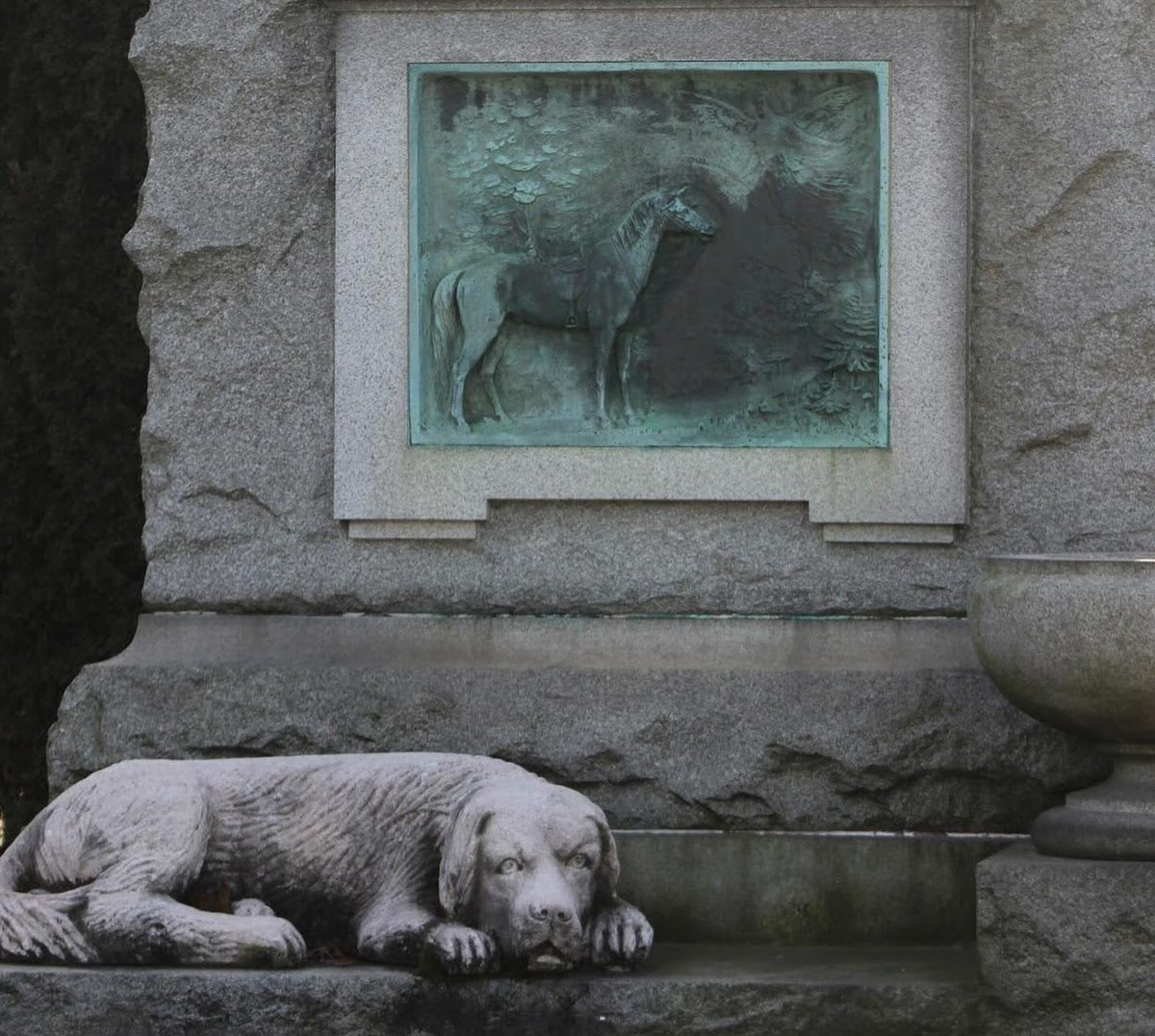 As Derby excitement descends upon Louisville, Kentucky, we’re taking a moment to appreciate the monumental equine “residents” of Green-Wood. The bronze relief horse on the Lewis memorial has the good fortune of another four-legged friend for eternal company.